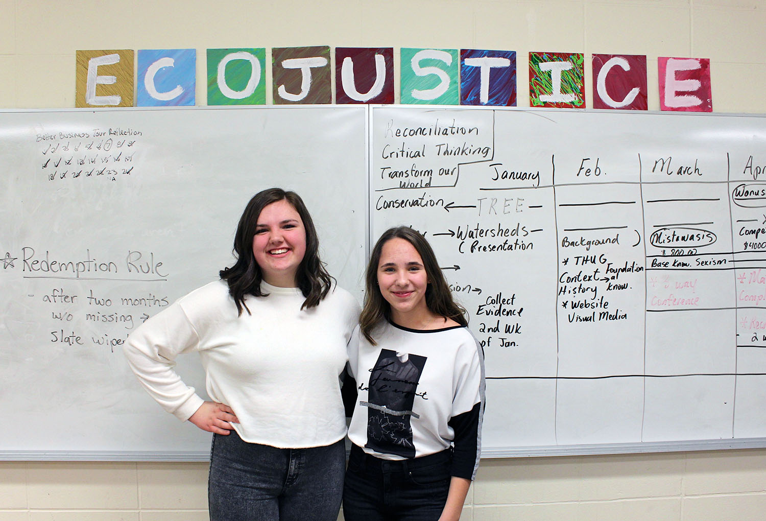 Grade 8 EcoJustice students Ava Visentini (left) and Aleksandra Zatorska (right) took part in leading a forum discussion for other students on how to prevent food waste in daily life, following the Health Sciences screening of the documentary Just Eat It.